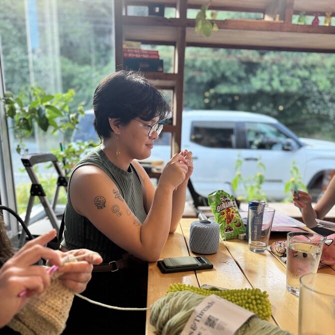 Member Kacey crocheting earrings